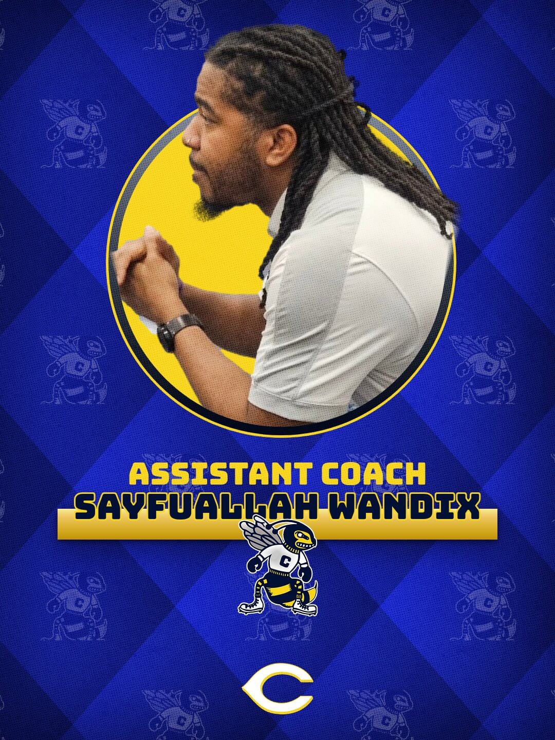 Coach Sayf working with athletes on the mat